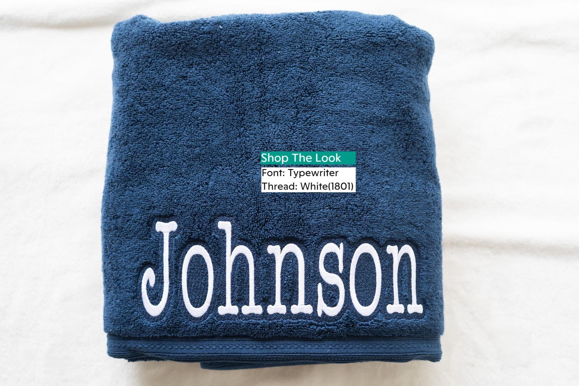a blue towel with the name of a person on it