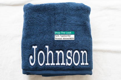 a blue towel with the name of a person on it