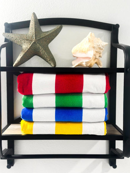 a stack of towels sitting on top of a shelf