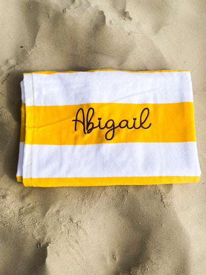 a towel that is laying in the sand